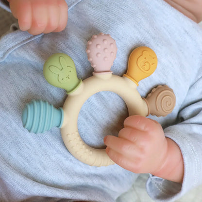 Chewwy: Textured Silicone Teething Ring with Rattle for Soothing Relief and Playtime Fun