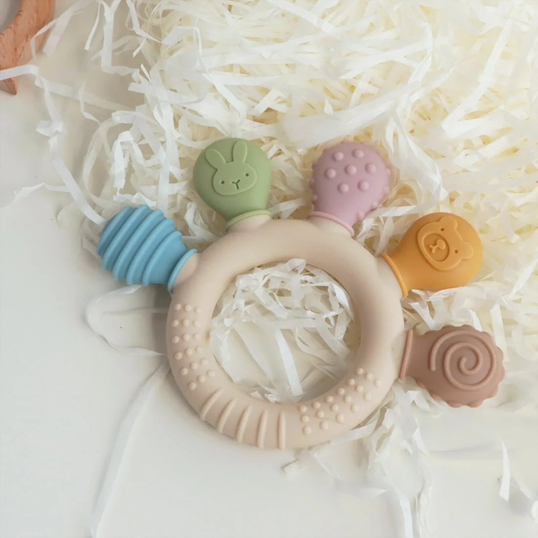 Chewwy: Textured Silicone Teething Ring with Rattle for Soothing Relief and Playtime Fun