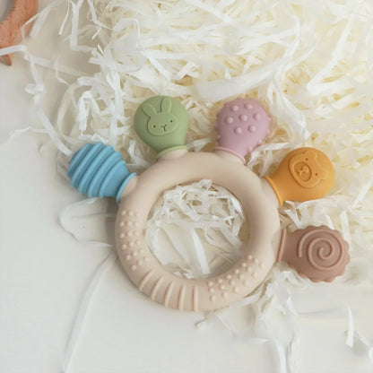 Chewwy: Textured Silicone Teething Ring with Rattle for Soothing Relief and Playtime Fun