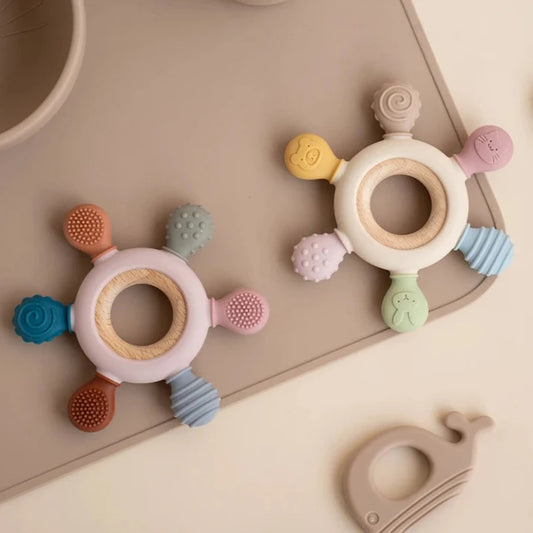 Tuggo V2 : High-quality baby teething toy with 6 multi-texture bite options, promoting soothing relief and active play.