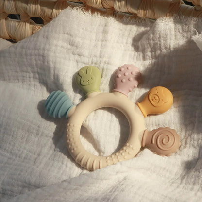 Chewwy: Textured Silicone Teething Ring with Rattle for Soothing Relief and Playtime Fun